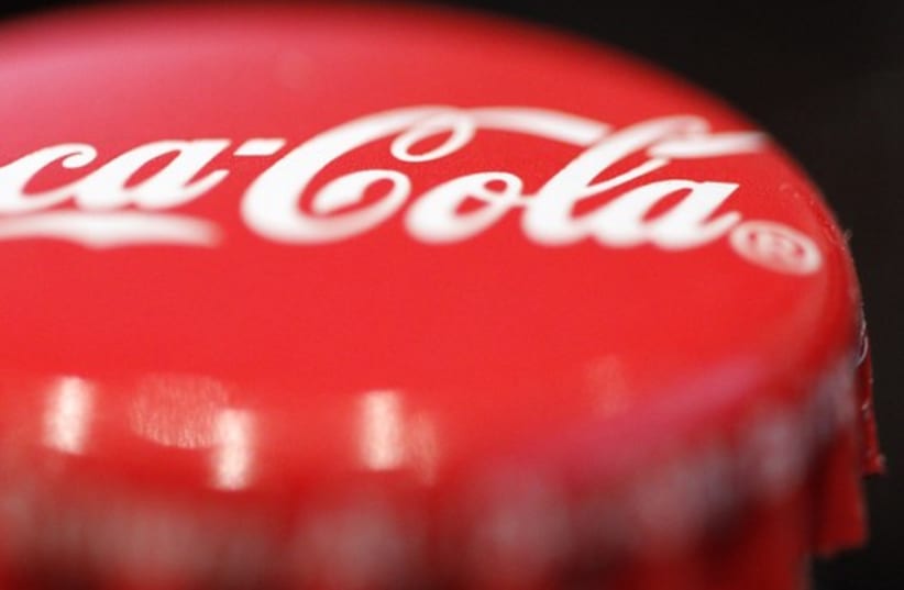 A logo is seen on a Coca-Cola bottle  (photo credit: REUTERS)