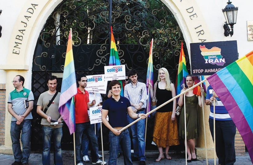 MEMBERS OF Colegas, the Spanish confederation of lesbian, gay, bisexual and transgender people, demonstrate in front of the Iranian embassy in 2009. (photo credit: REUTERS)