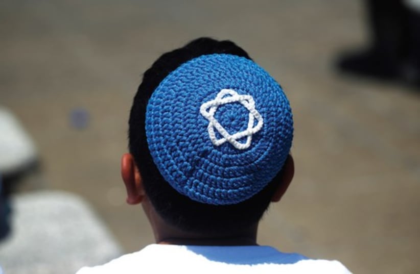 A boy wears a yarmulke (photo credit: REUTERS)