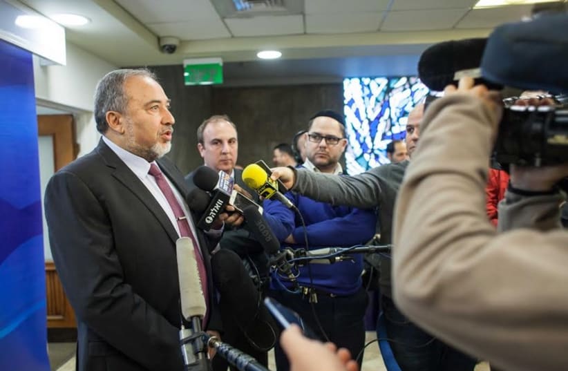 Foreign Minister Avigdor Liberman speaks to the press before the weekly cabinet meeting in Jerusalem (photo credit: EMIL SALMAN/POOL)