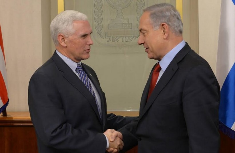 Prime Minister Benjamin Netanyahu meets with Mike Pence, December 29, 2014 (photo credit: AMOS BEN GERSHOM, GPO)