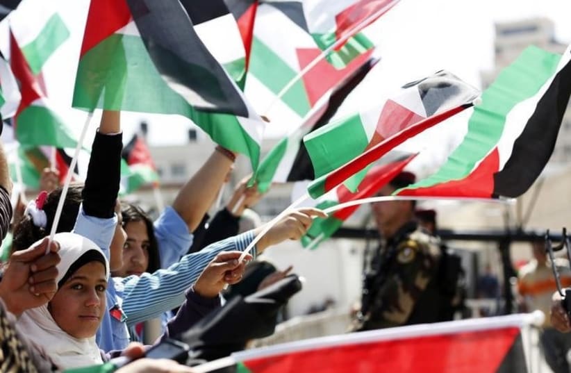 Palestinians in the West Bank city of Ramallah (photo credit: REUTERS)