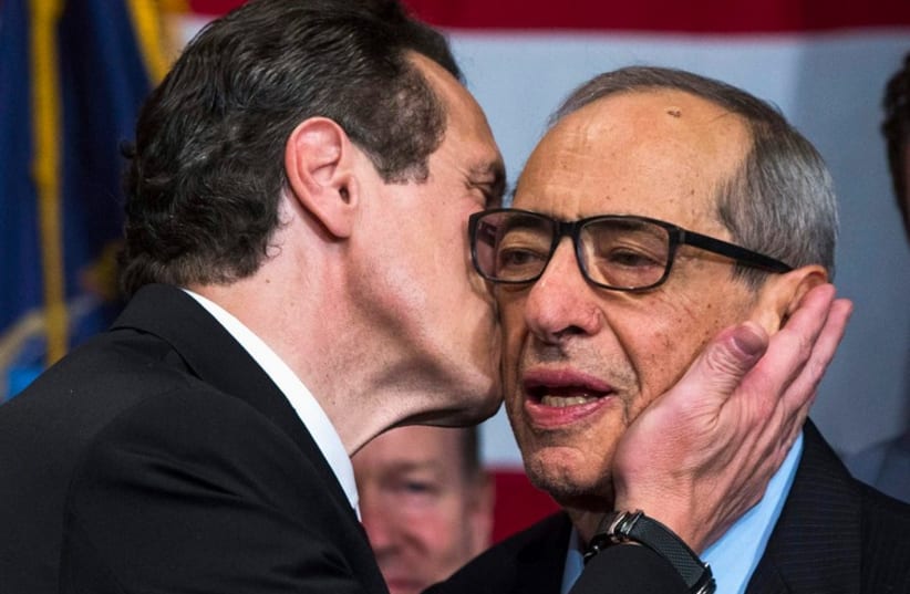 Democratic Governor Andrew Cuomo embraces his father Mario (photo credit: REUTERS)