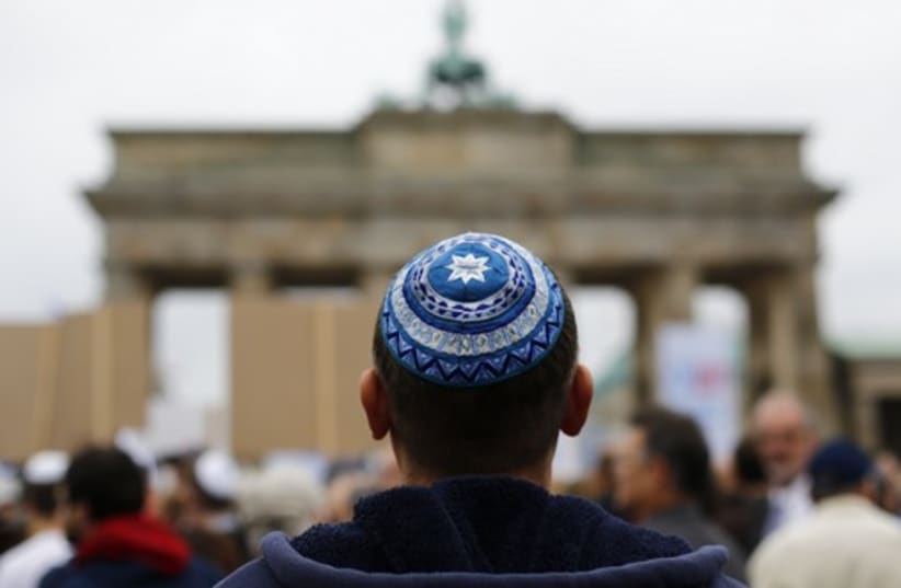 A man wearing a kippah at Berlin's Brandenburg Gate. (photo credit: REUTERS)