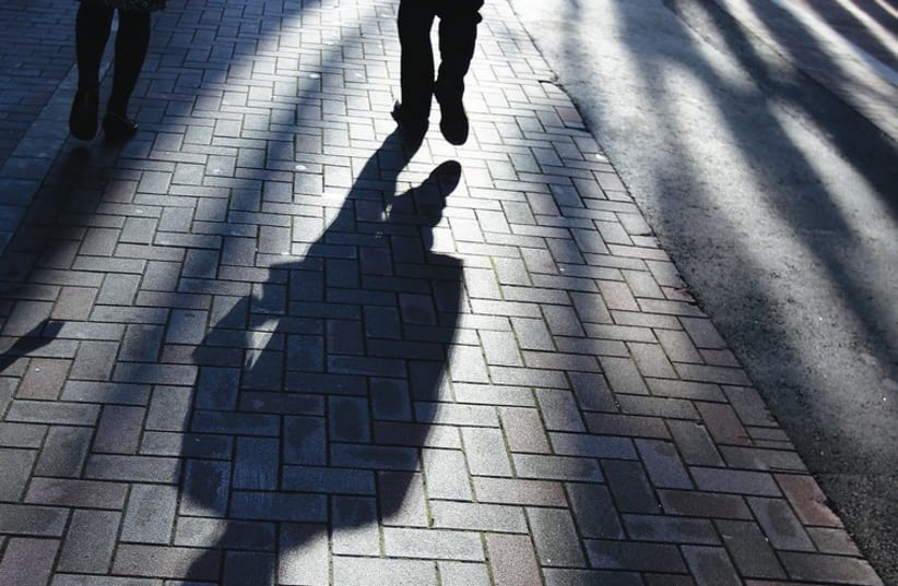 UNETHICAL PRACTICES cast a shadow, much like the one in this photo, over one’s professional life. (photo credit: REUTERS)