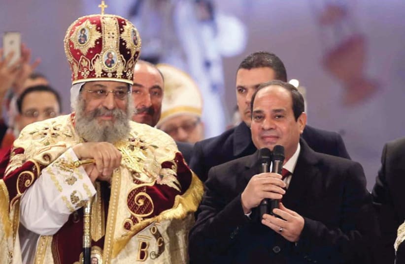 EGYPTIAN PRESIDENT Abdel Fattah al-Sisi speaks next to Coptic Pope Tawadros II (photo credit: REUTERS)