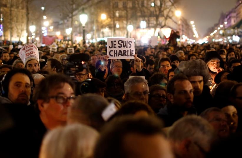 Paris vigil for victims of the shooting that left 12 dead at office of a satirical magazine (photo credit: REUTERS)