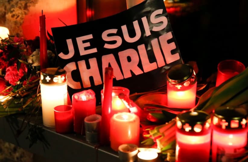 Candelight vigil in tribute to the victims of the shooting at the office of Charlie Hebdo (photo credit: REUTERS)