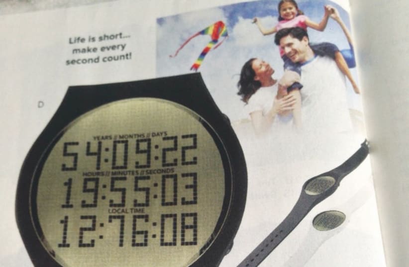 An advertisement for a ‘Happiness’ watch that counts down your life. (photo credit: STEWART WEISS)
