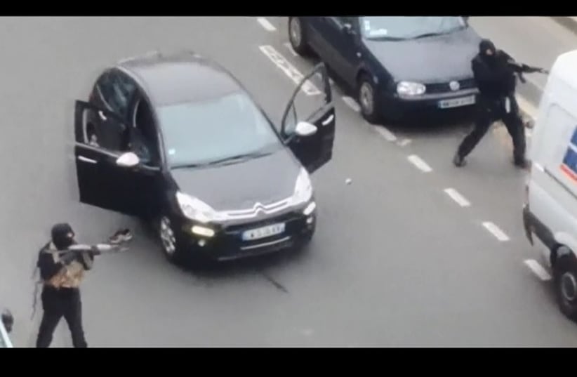 Amatuer video shows Paris gunmen shooting policeman (photo credit: REUTERS)