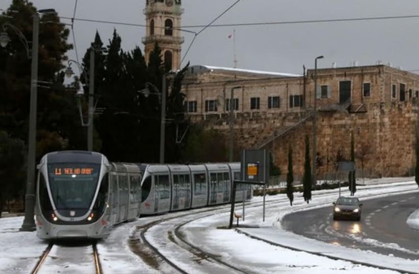 Jerusalem Light Rail in snow (photo credit: MARC ISRAEL SELLEM/THE JERUSALEM POST)
