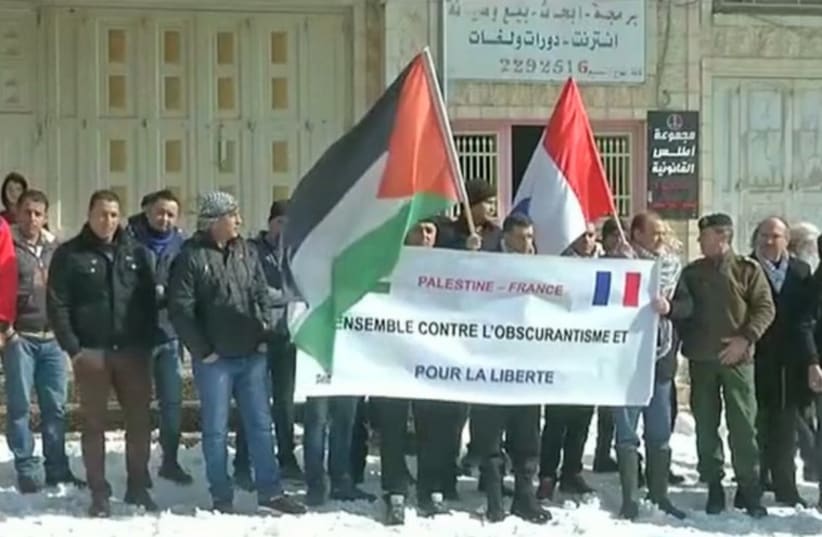 Palestinians in Hebron protest Paris terror attacks, January 10, 2015 (photo credit: screenshot)