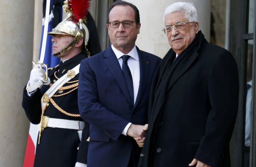 French President Francois Hollande welcomes Palestinian President Mahmoud Abbas at the Elysee Palace. (photo credit: REUTERS)