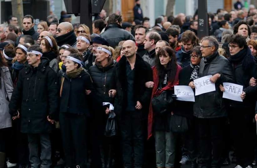 Families of French terror victims in soldiarity march (photo credit: REUTERS)