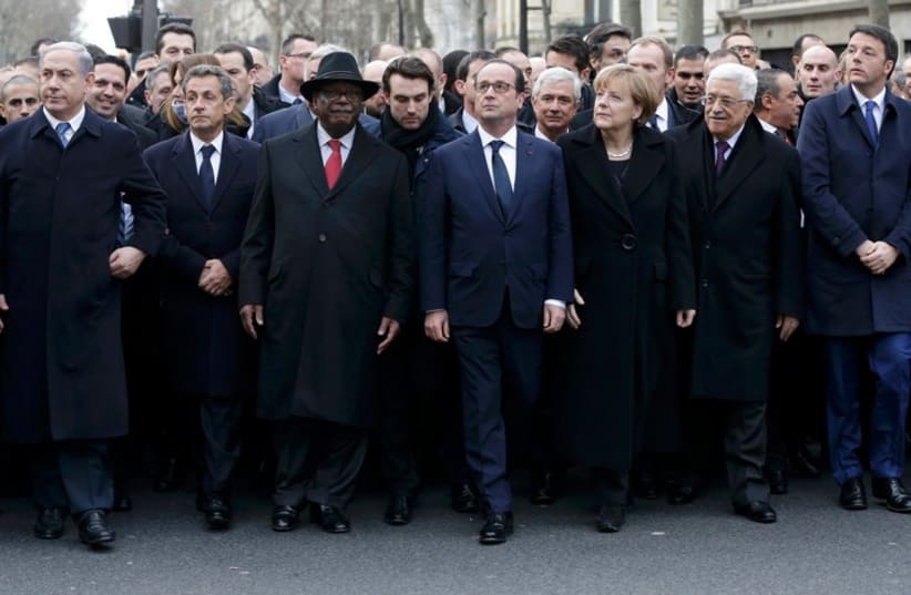 World leaders including Netanyahu and Abbas flank French Presdient Francois Hollande at Paris solidarity rally (photo credit: REUTERS)