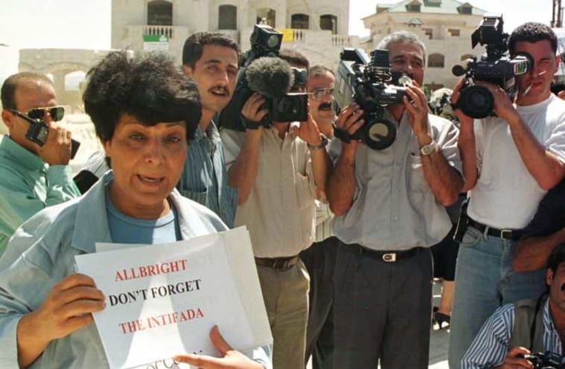 LEILA KHALED holds a banner outside the US Embassy in Jordan during a protest in 1997. (photo credit: REUTERS)