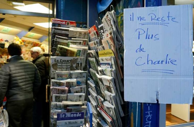 Handwritten sign at Paris newstand reads 'No more Charlie' as copies of satirical magazine Charlie Hebdo sell out (photo credit: REUTERS)