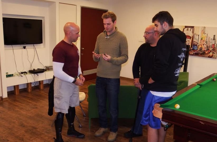 Staff Sgt. Brian Mast meeting with injured IDF veterans. (photo credit: Courtesy)