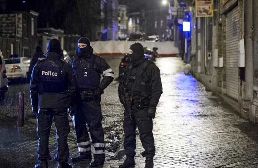 Belgian special forces police block a street in central Verviers (photo credit: REUTERS)