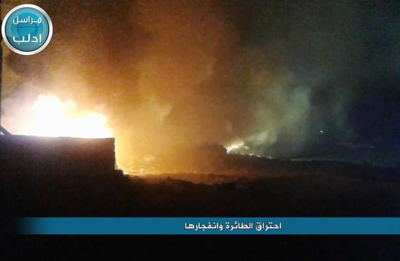 Syrian media coverage of a crashed military plane in flames (photo credit: SYRIAN MEDIA)