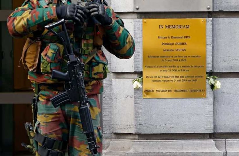 A Belgian soldier guards the entrance of the Jewish Museum in central Brussels January 18 (photo credit: REUTERS)