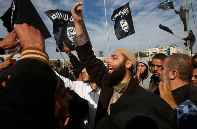 Salafists in Gaza fly ISIS ( Islamic State) flags (photo credit: REUTERS)
