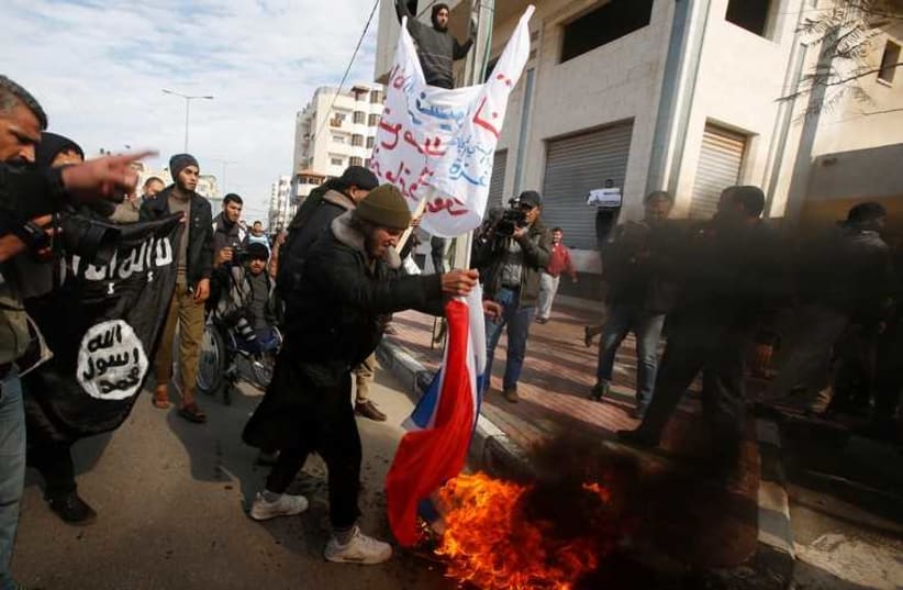 Palestinian Salafists protest against satirical French weekly magazine Charlie Hebdo, outside the French Cultural Centre in Gaza (photo credit: REUTERS)