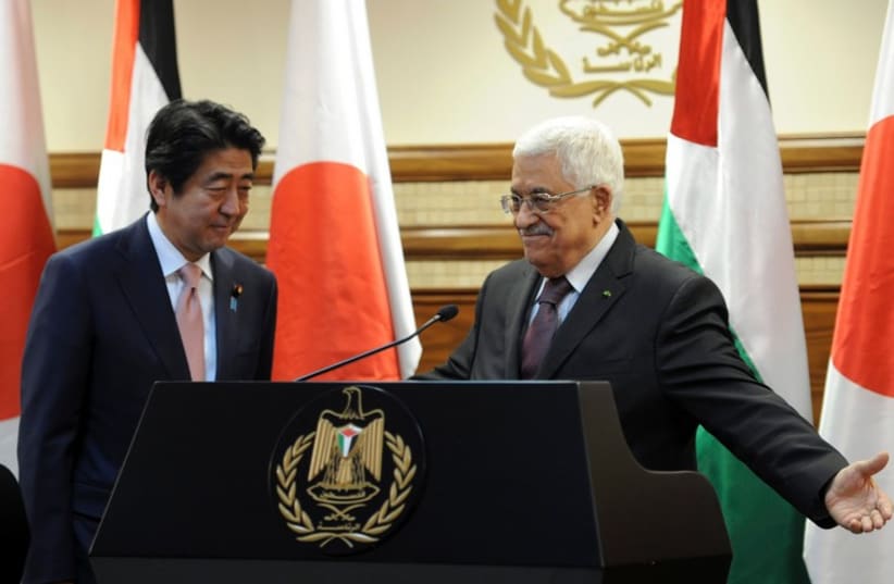 PA President Mahmoud Abbas with PM of Japan Shinzo Abe, Ramallah, January 20, 2015  (photo credit: REUTERS)