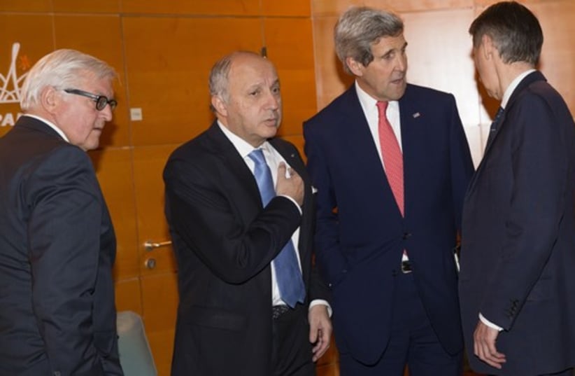 U.S. Secretary of State John Kerry (2nd R) talks with German Foreign Minister Frank-Walter Steinmeier (L), French Foreign Minister Laurent Fabius and British Foreign Minister Philip Hammond (R) in Paris (photo credit: REUTERS)