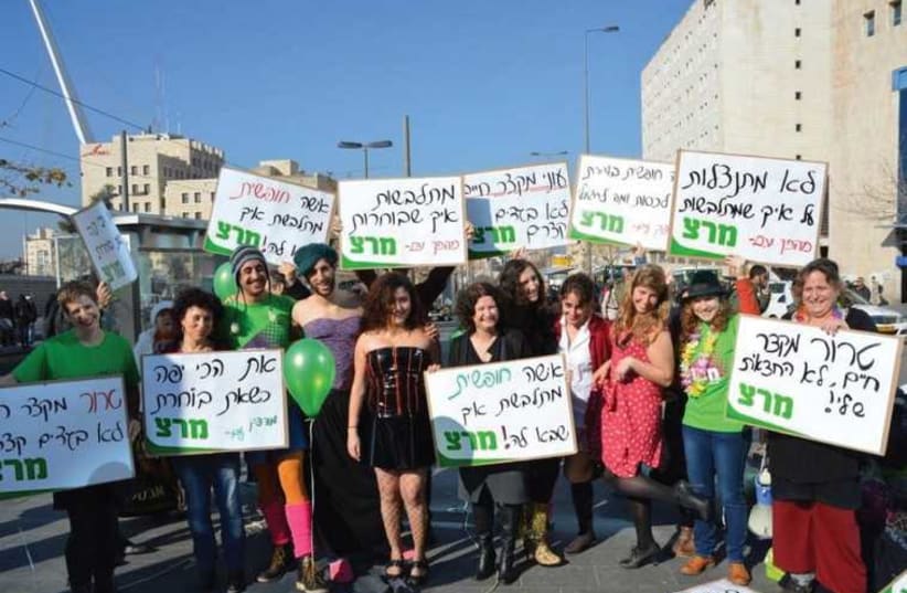 Meretz activists protest bus ads claiming that short clothing shortens life. (photo credit: MERETZ)