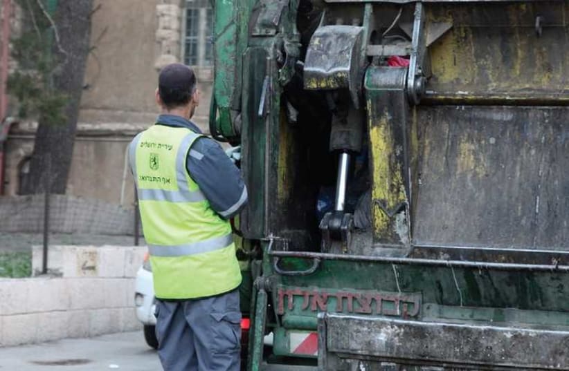 Garbage truck (photo credit: MARC ISRAEL SELLEM/THE JERUSALEM POST)