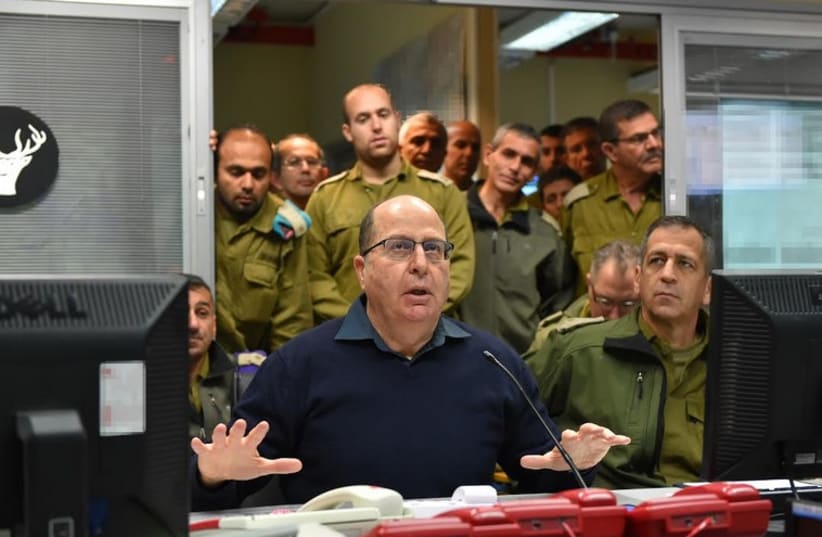 Defense Minister Moshe Ya'alon visiting the IDF Northern Command headquarters with Northern Command chief Maj.-Gen. Aviv Kochavi to his right (photo credit: ARIEL HERMONI / DEFENSE MINISTRY)
