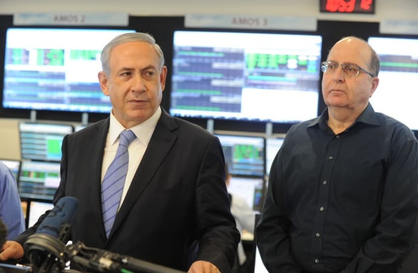 Prime Minister Benjamin Netanyahu visits Israel Aerospace Industries‏. (photo credit: POOL/AVSHALOM SASSONI)