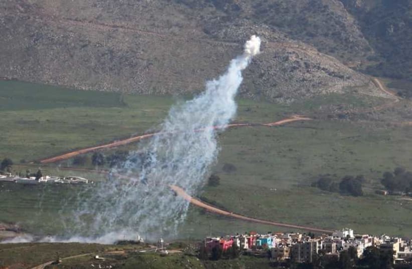 Smoke rises from shells fired from Israel over al-Wazzani area in southern Lebanon (photo credit: REUTERS)