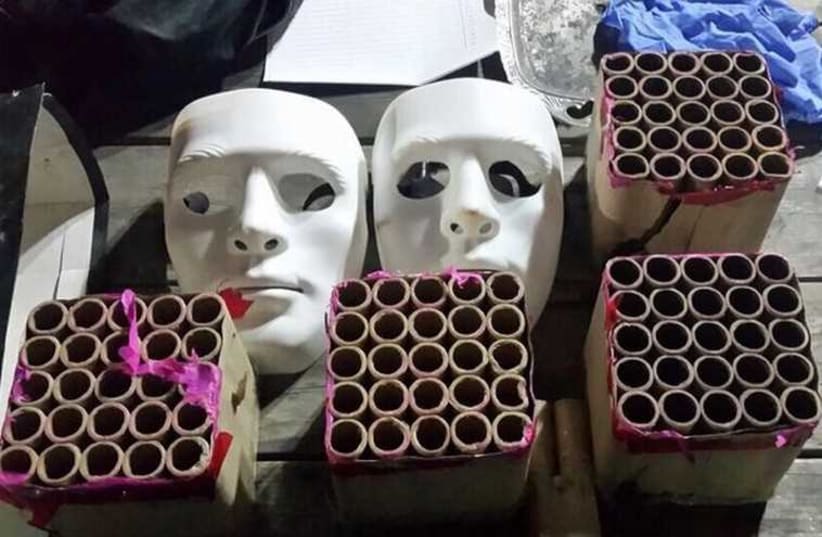 Masks and firecrackers seized after Arab teen attacked police with firecrackers in east Jerusalem Saturday night. (photo credit: JERUSALEM POLICE)