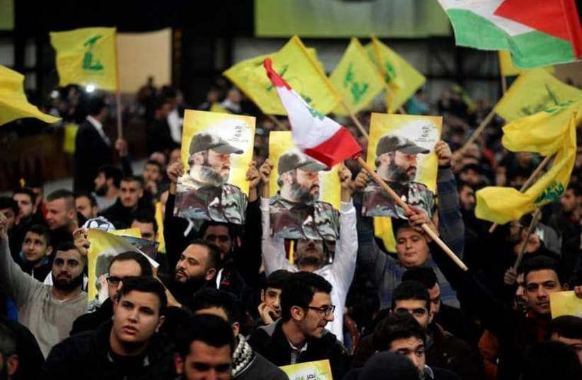 Hezbollah supporters during a televized speech by the group's leader Sayyed Hassan Nasrallah in Beirut (photo credit: REUTERS)