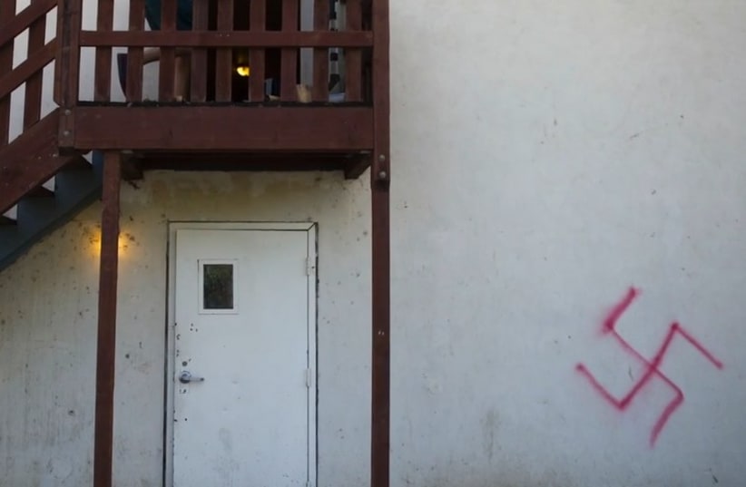 Swastika spraypainted on a wall at a Jewish fraternity house near UC Davis (photo credit: YOUTUBE SCREENSHOT)