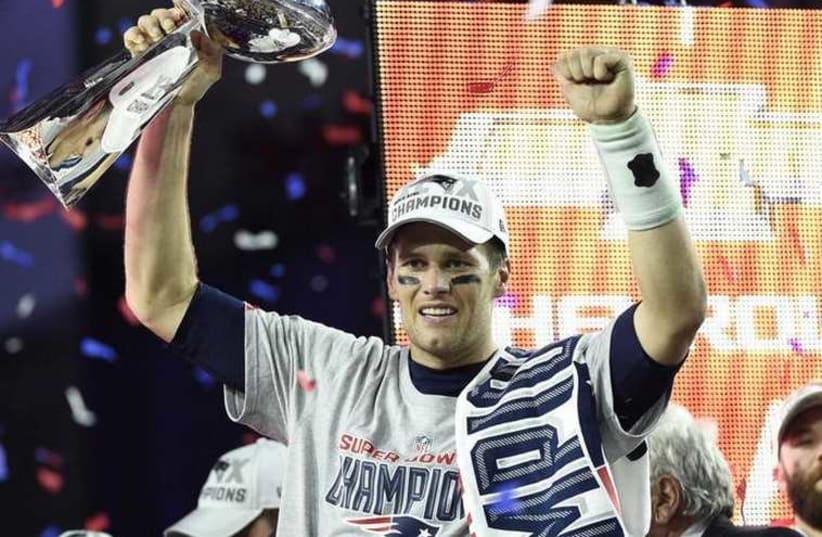 New England Patriots quarterback Tom Brady reacts after winning the Super Bowl (photo credit: REUTERS)