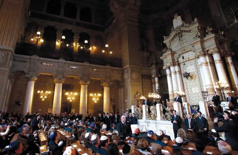 PRIME MINISTER Benjamin Netanyahu addresses the Jewish community in a Rome synagogue during Hanukka 2013. (photo credit: REUTERS)