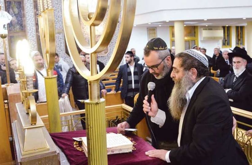 A gathering held in Netanya’s Great Synagogue last month in solidarity with the French Jewish community after the Hyper Cacher attack. (photo credit: THE JEWISH AGENCY)