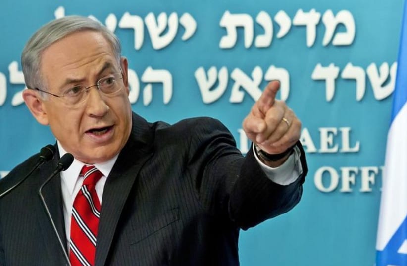 Prime Minister Benjamin Netanyahu gestures during a news conference at his office in Jerusalem (photo credit: REUTERS)