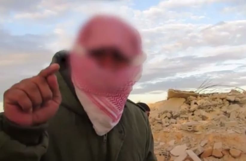 Sinai terrorist who decapitated alleged Israeli spy‏ (photo credit: screenshot)