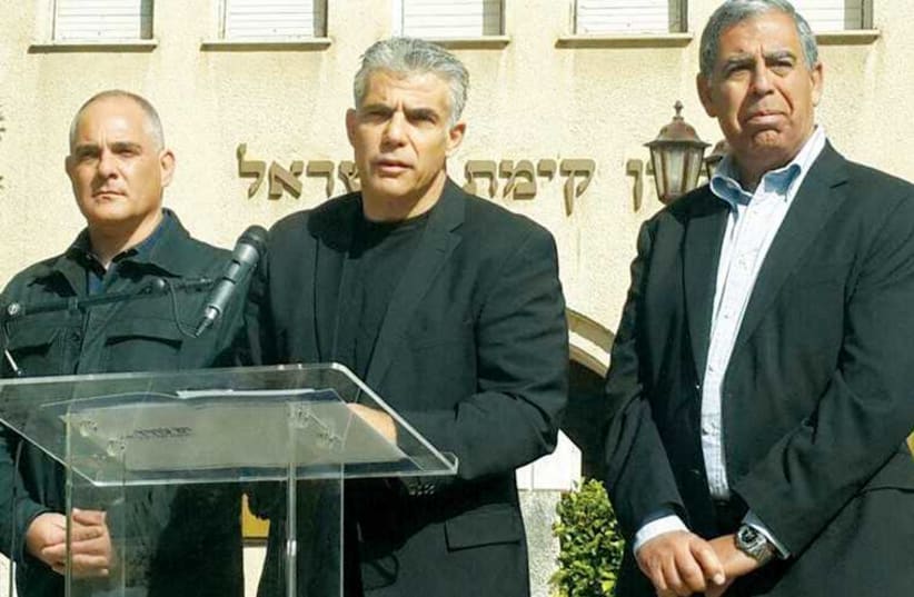 YESH ATID leader Yair Lapid speaks outside the Keren Kayemeth LeIsrael-Jewish National Fund museum in Tel Aviv (photo credit: FACEBOOK)