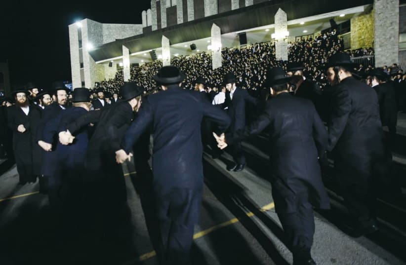 Satmar hassidim dance at a Lag Ba’omer celebration in Kiryat Joel. (photo credit: REUTERS)