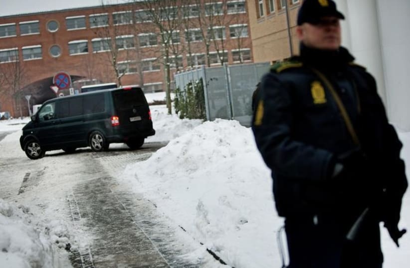 A Danish police officer stands guard in Copenhagen (photo credit: REUTERS)