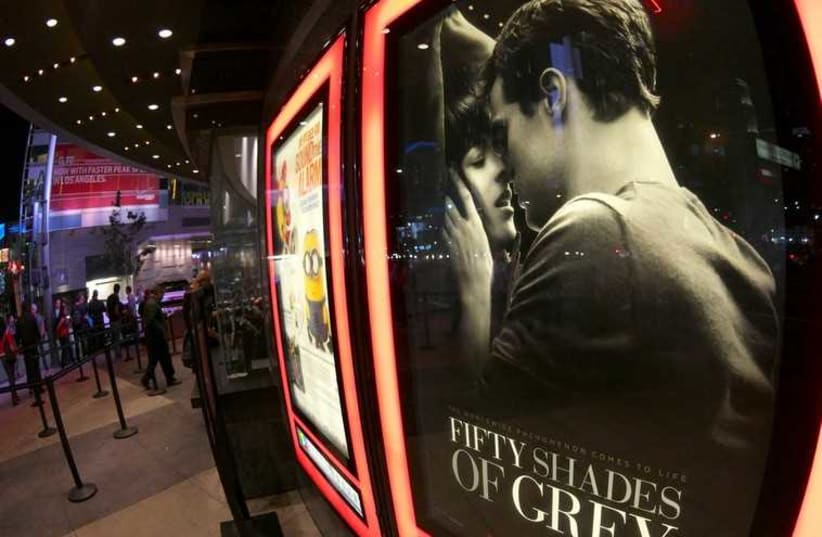 A film poster for "Fifty Shades of Grey" is pictured at Regal Theater in Los Angeles (photo credit: REUTERS)