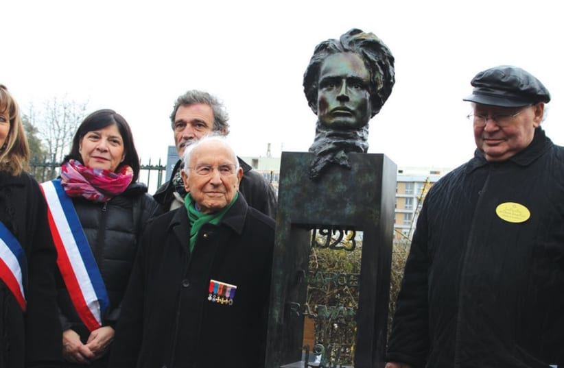 NAZI HUNTER Serge Klarsfeld (right), resistance veteran Roger Fichtenberg (center) and sculptor Denis Chetboun stand next to the newly inaugurated statue of Marcel Rajman in Paris on Sunday. (photo credit: RINA BASSIST)