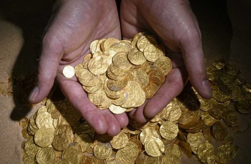 Gold coins found at ancient port in Caesarea (photo credit: CARLA AMIT- ISRAEL ANTIQUITIES AUTHORITY)