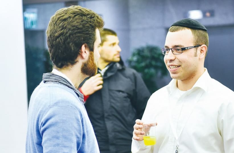 PARTICIPANTS TALK at an 8200 Entrepreneurship and Innovation Support Program last week in Tel Aviv. (photo credit: Courtesy)