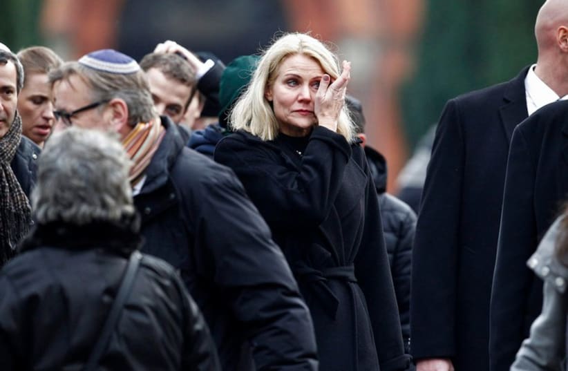 Danish Prime Minister Helle Thorning Schmidt (C) reacts after the funeral ceremony of shooting victim Dan Uzan, who died on Saturday when a gunman attacked a synagogue, in Copenhagen February 18, 2015. (photo credit: REUTERS)